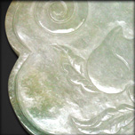 A JADEITE PLAQUE IN A RUYI SHAPE, LATE QING 19TH