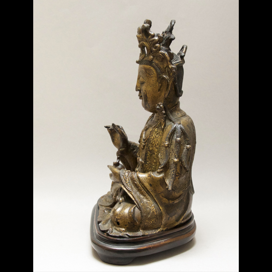 A GOLD LACQUERED BRONZE GUANYIN FIGURE