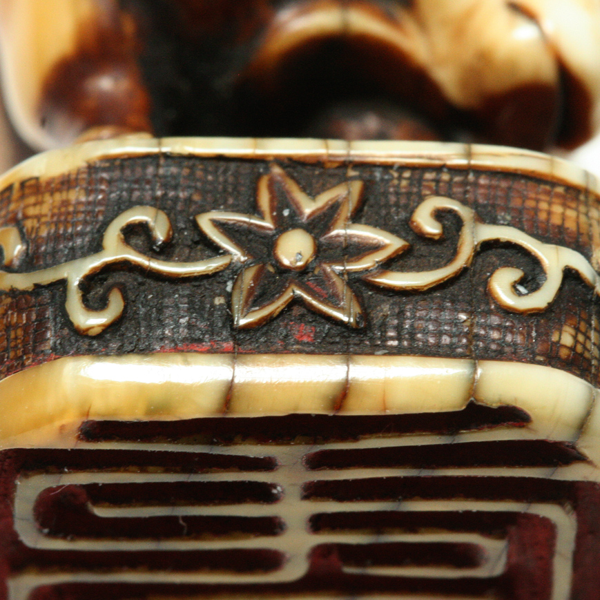 AN IVORY SEAL NETSUKE FIGURE OF SOUHO, EDO LATE 18TH