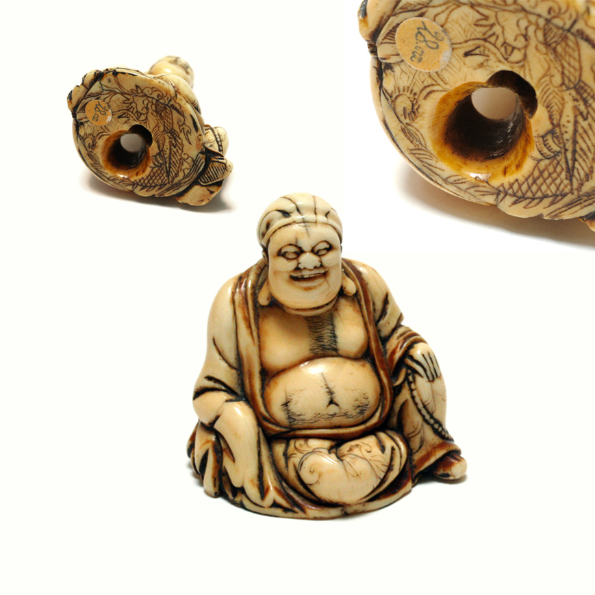 AN IVORY NETSUKE FIGURE OF HOTEI