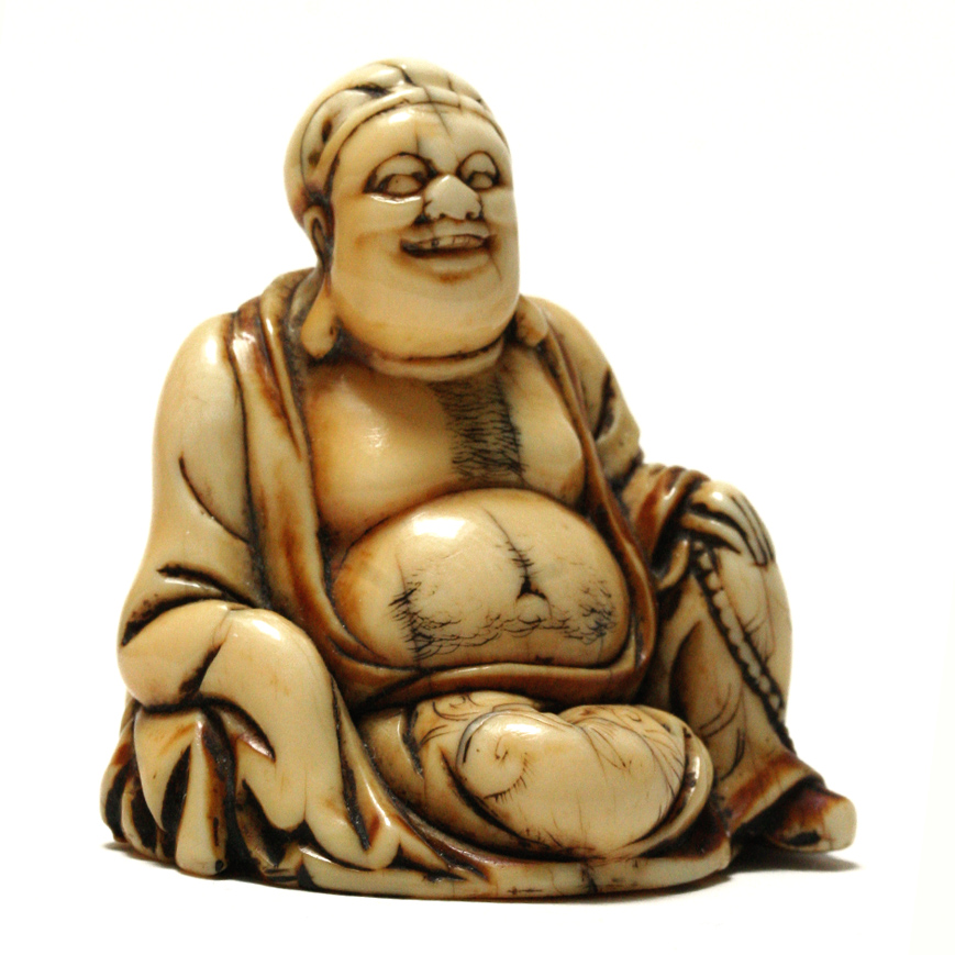 AN IVORY NETSUKE FIGURE OF HOTEI