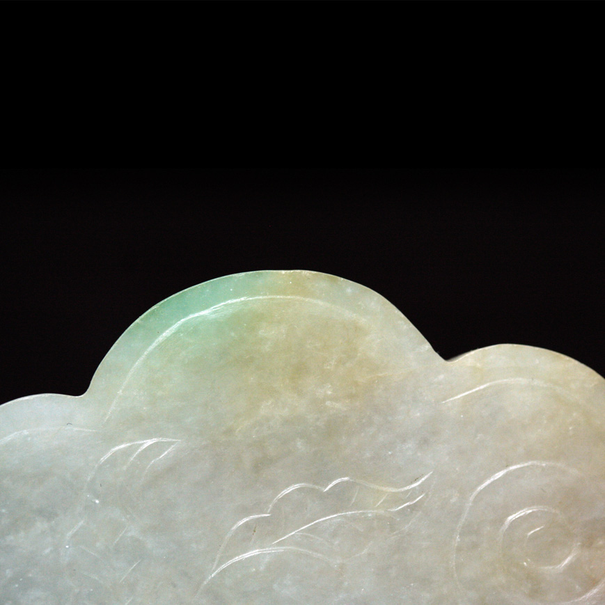 A JADEITE PLAQUE IN A RUYI SHAPE, LATE QING 19TH
