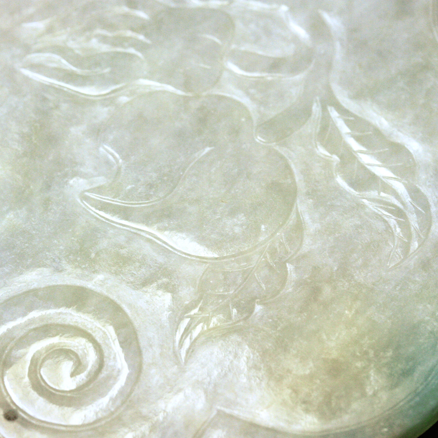 A JADEITE PLAQUE IN A RUYI SHAPE, LATE QING 19TH