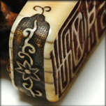 AN IVORY SEAL NETSUKE FIGURE OF SOUHO, EDO LATE 18TH