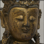 A GOLD LACQUERED BRONZE GUANYIN FIGURE